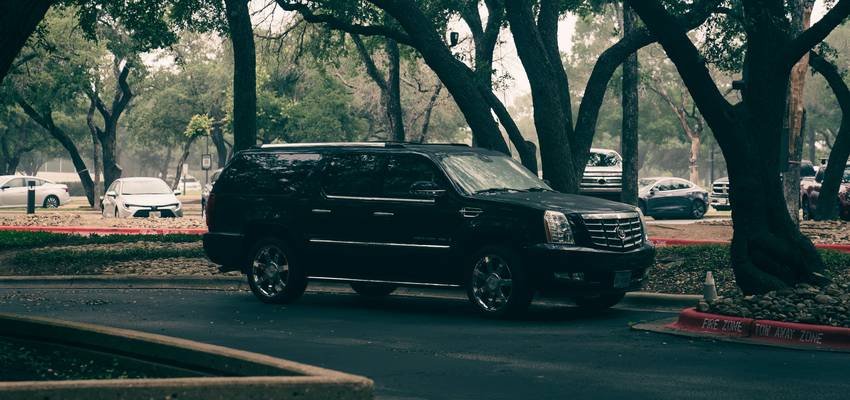 A car with Uber and Turo decals parked in Texas