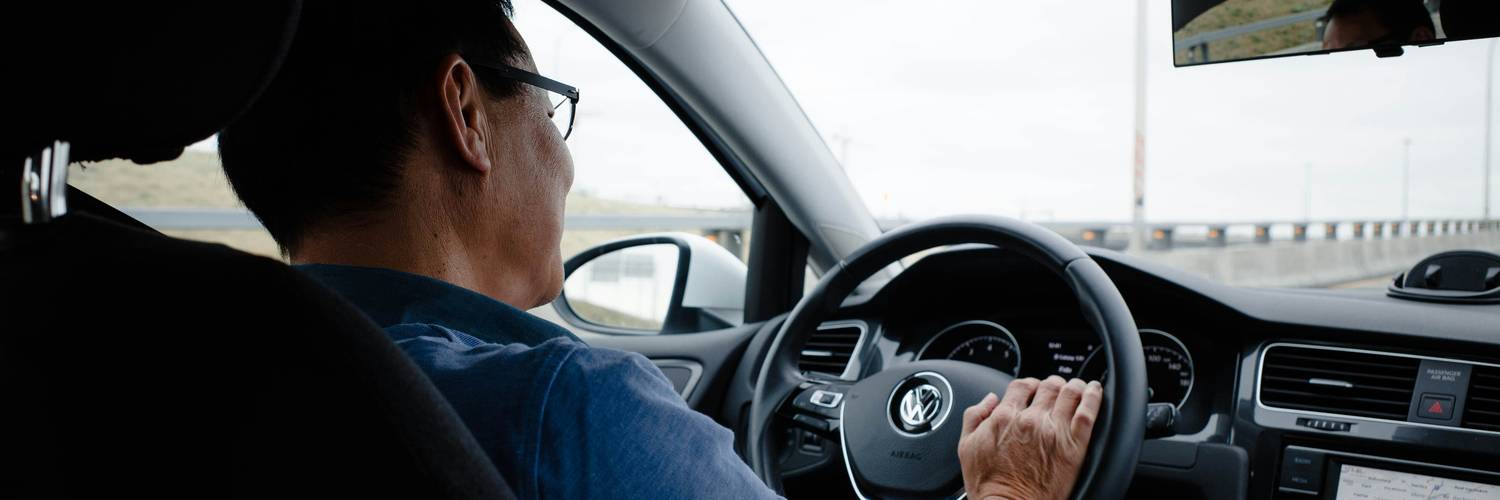 Rideshare driver on Texas road, representing insurance needs for Uber and Lyft drivers