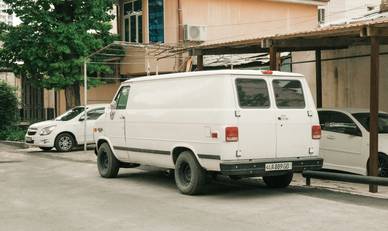 Texas small business owner with work vans for plumbing or contracting