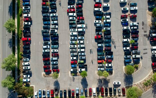 Texas business owners and delivery drivers with their vehicles, parked or on the move in a Texas city