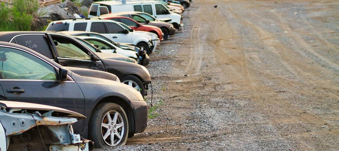 A Texas family driveway showing multiple cars, representing multi-car auto insurance discounts in Texas